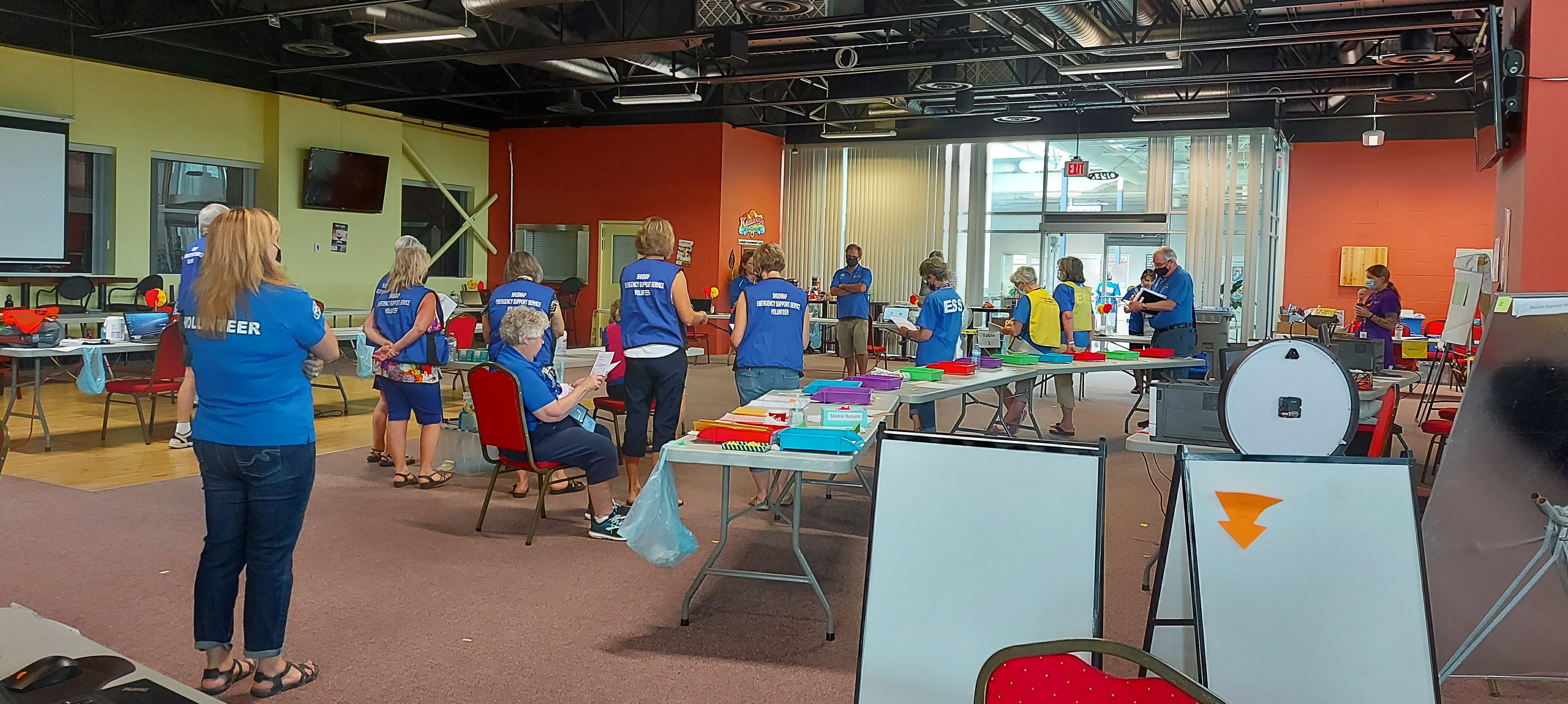 ESS volunteers in a room for morning briefing.
