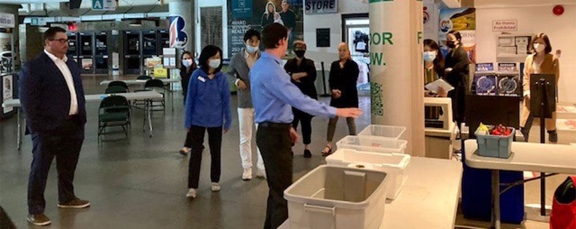 Group gathering at the Sandman Centre Cooling Centre activity table