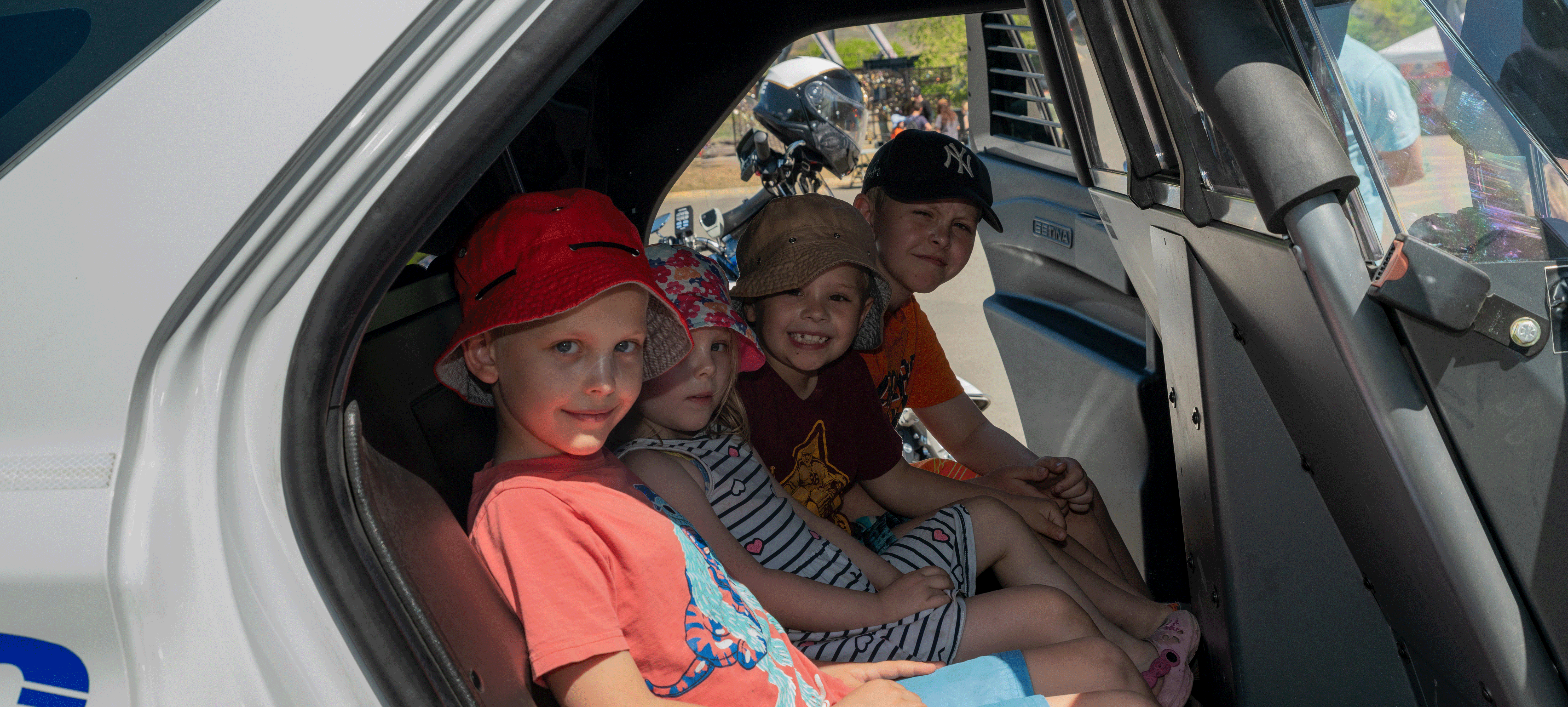 Kids in back of police car
