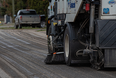 Sweeping machine cleaning the street