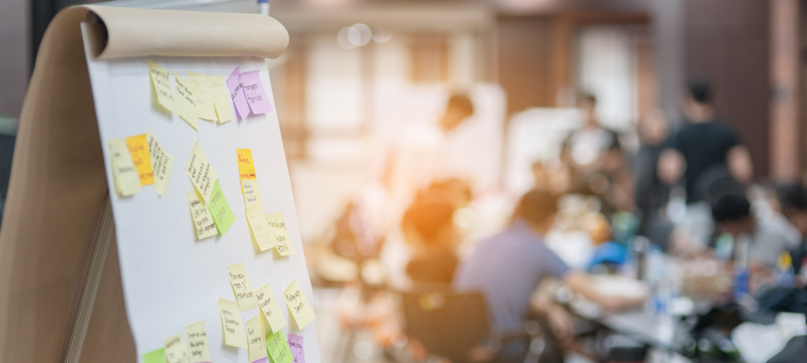 A board with sticky notes on it