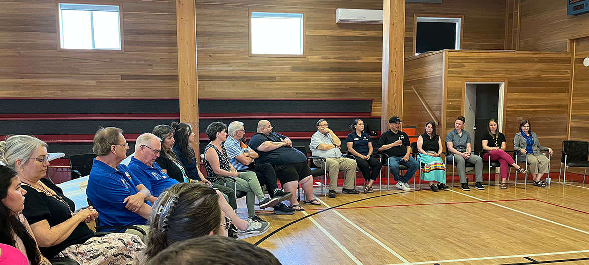 Individuals in chairs in a half circle