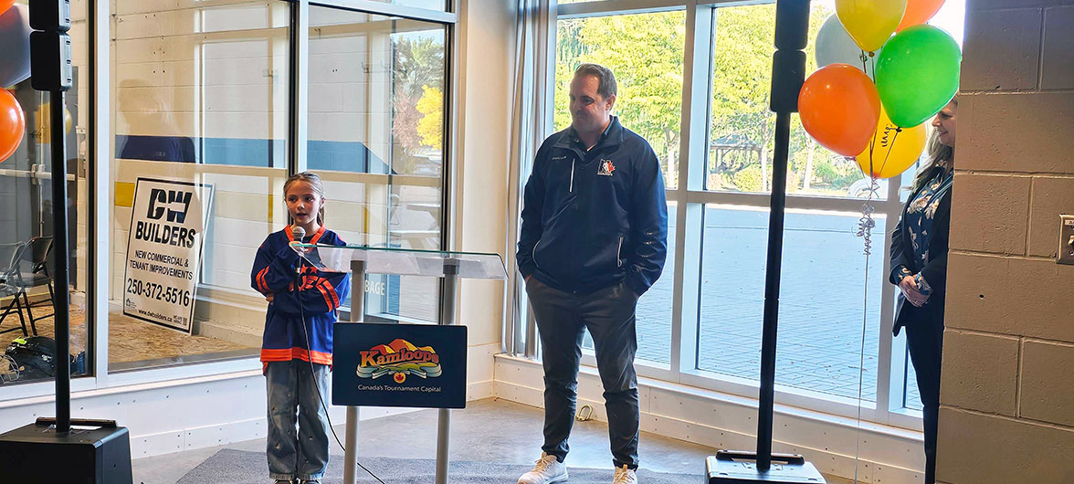girl in hockey jersey behind podium