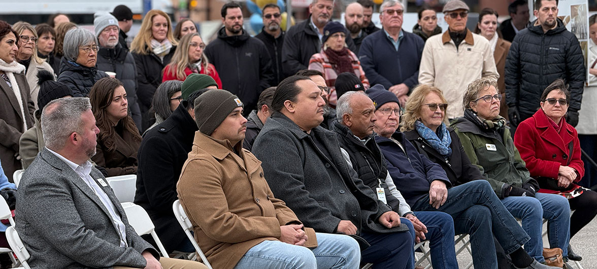 crowd sitting in chairs