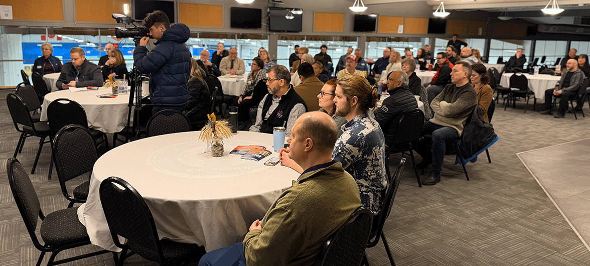 crowd seated at round tables