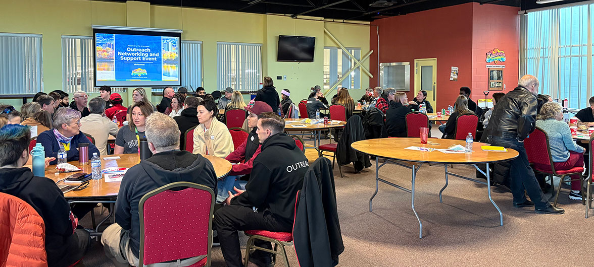 room full of conference attendees