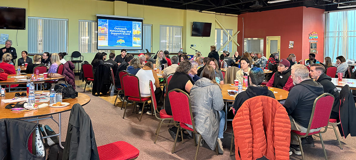 room full of conference attendees