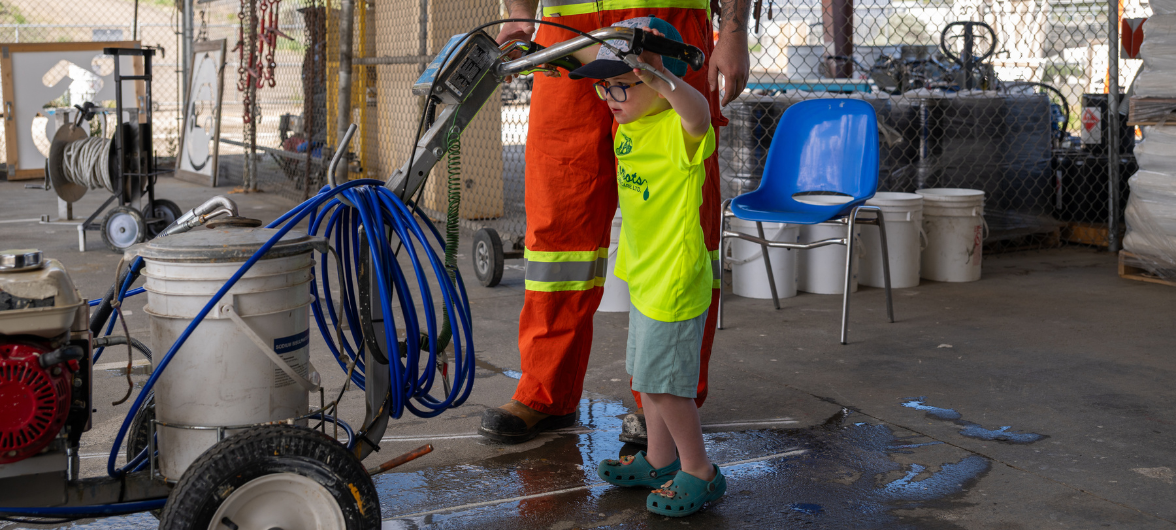 A kid pushing an equipment