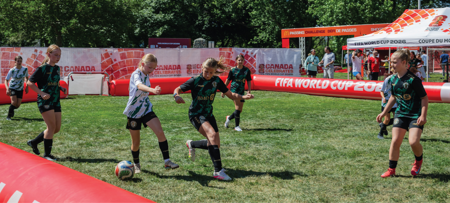 kids playing a fun soccer match in a mini field set up in Riverside Park