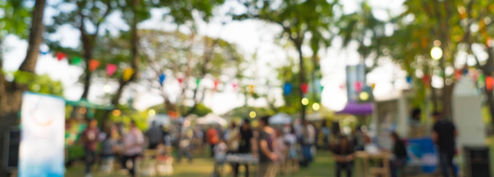 blurry shot of a generic outdoor event in a park