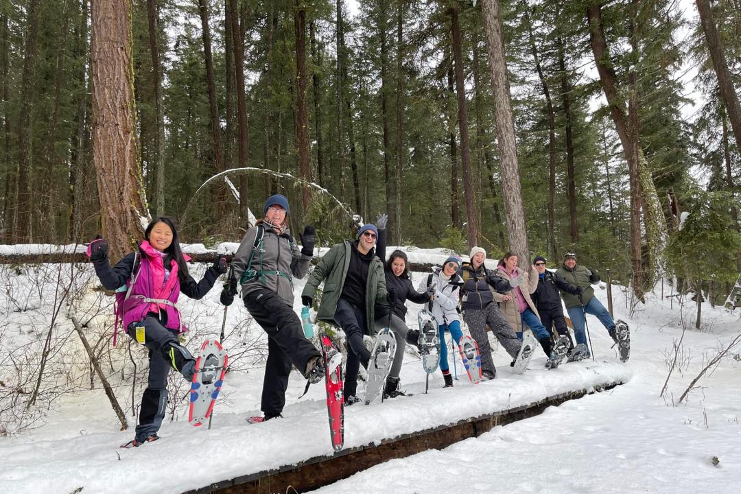 Group of men and women in a line with snowshoes