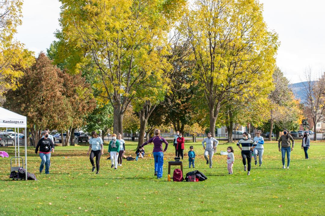 Outdoor zumba with women in children in a park