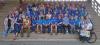 group of volunteers in blue shirts